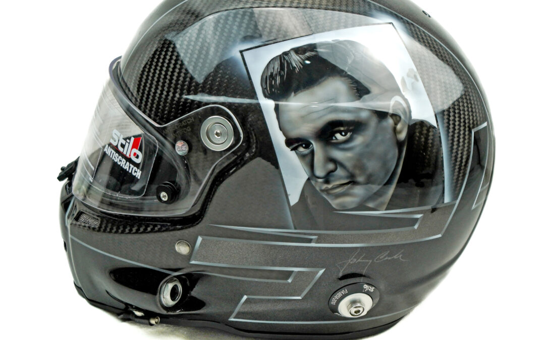 A carbon fibre Stilo helmet with a custom painted Johnny Cash Portrait on the left side