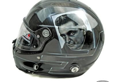 A carbon fibre Stilo helmet with a custom painted Johnny Cash Portrait on the left side