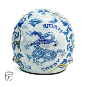 Custom painted crash helmet featuring a blue chinese dragon design on a white background with traditional Asain-inspired artwork and personalised detailing