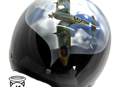 a picture of an airbrushed mural of a spitfire plane on the back of a crash helmet