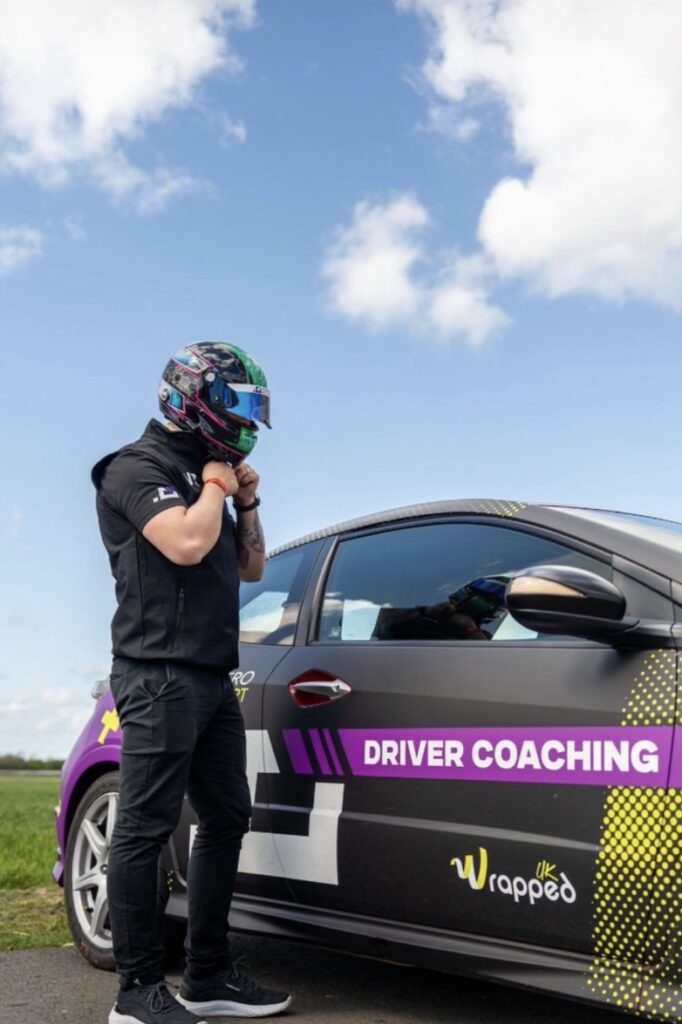 Racing driver William Jr Zollo wearing a custom painted helmet by X-Paint before a driver coaching session