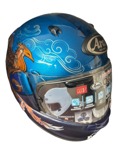 Custom painted Arai Quantic helmet side view with flowing feather detail in pale pink and white on violet to blue metallic fade