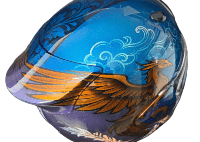 Side rear view of custom painted Arai Quantic motorcycle helmet with Russian inspired folk art panel and violet metallic fade