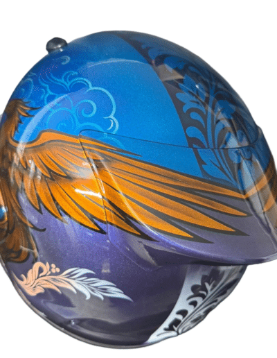 Bespoke airbrush painted motorcycle helmet with phoenix design in gold and amber on blue violet metallic, X-Paint Camberley