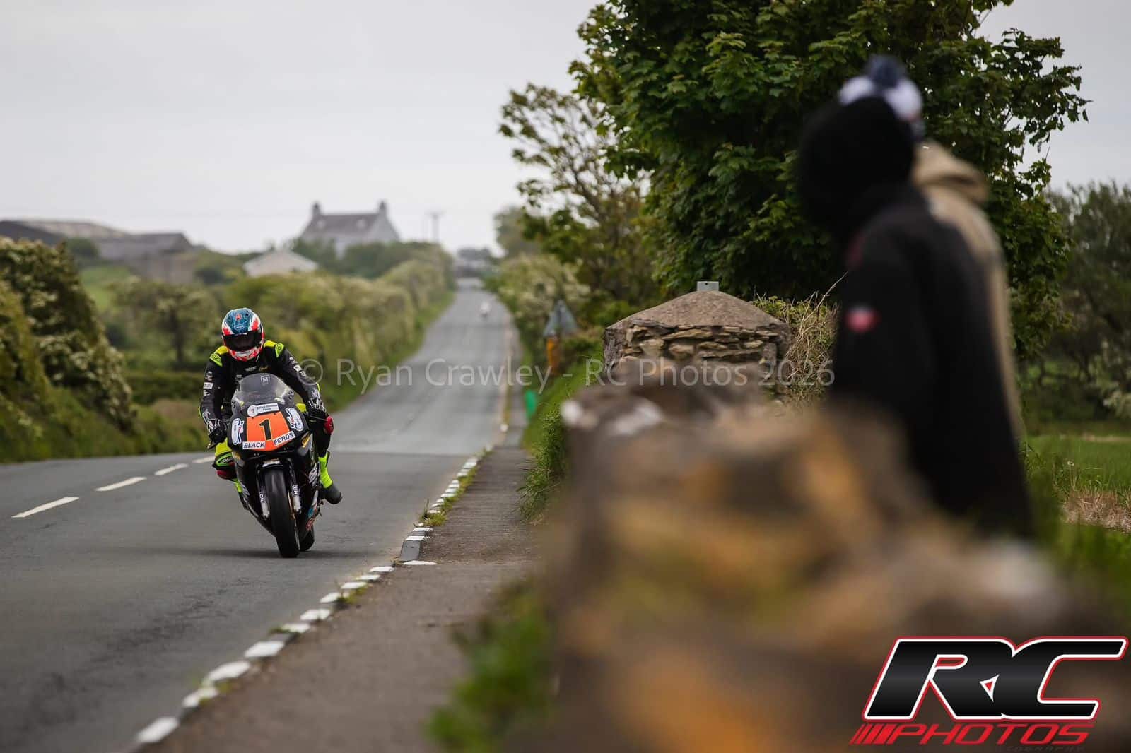 Grant Thomson number 1 on a public roads circuit wearing his X-Paint custom helmet