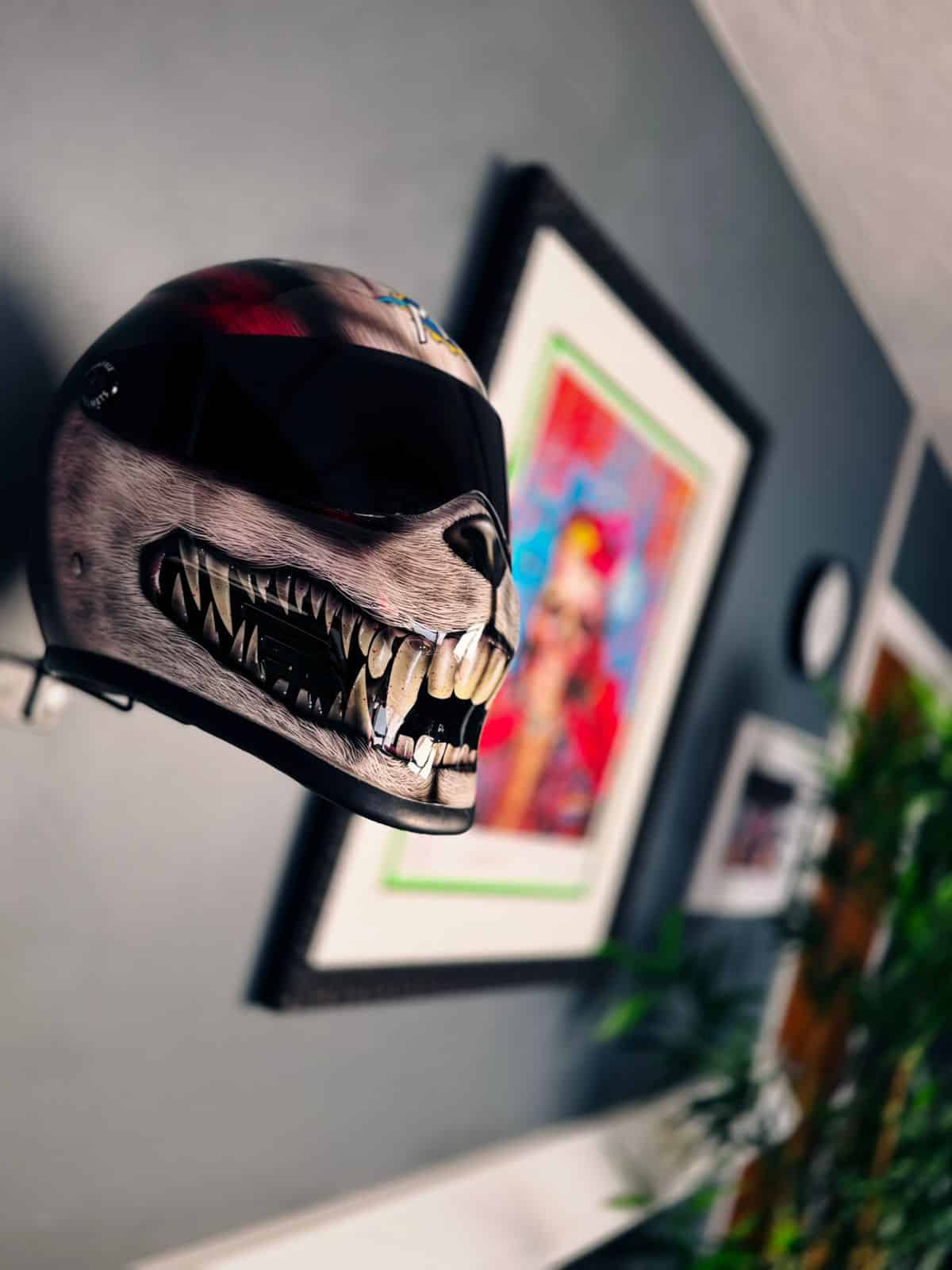 Custom airbrushed helmet with wolf skull design displayed at X-Paint studio, Creed Gallery, Sandown Coachworks Camberley