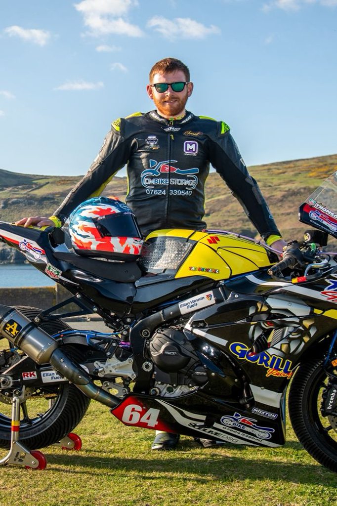 Grant Thompson preparing for the Isle of Man TT with the Gorilla Racing superbike and a custom painted racing helmet by X-Paint.