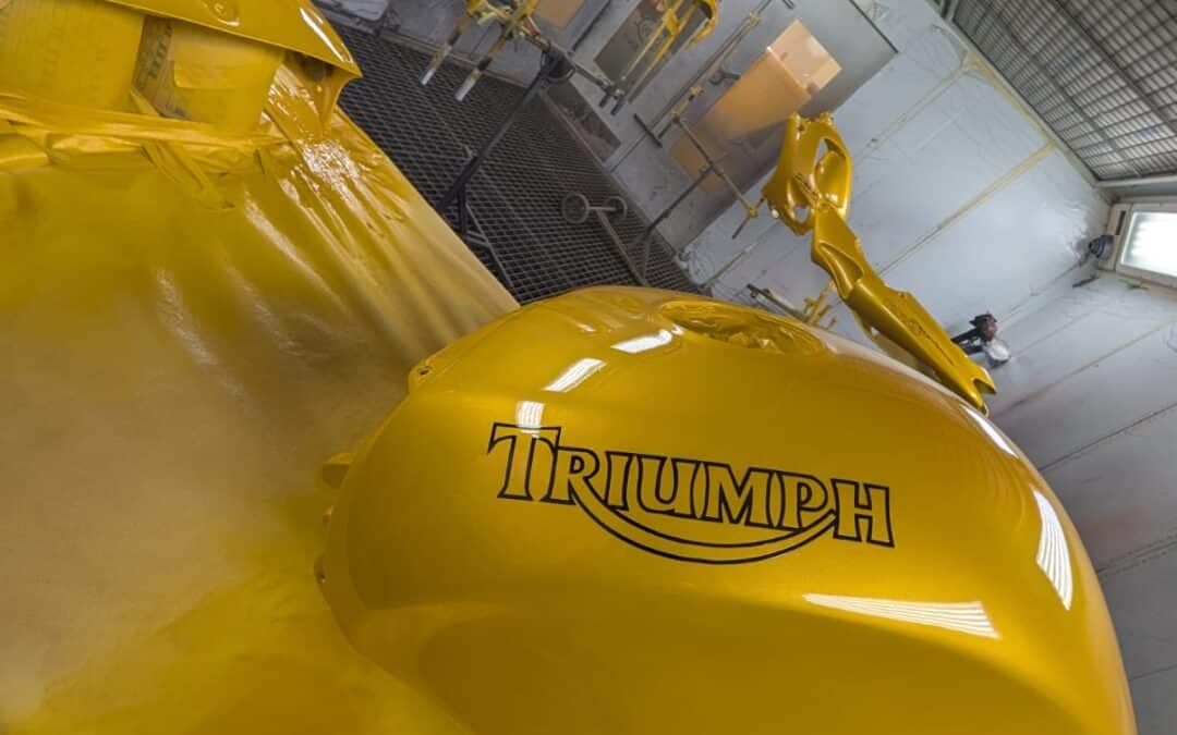 a gold triumph daytona tank freshly painted